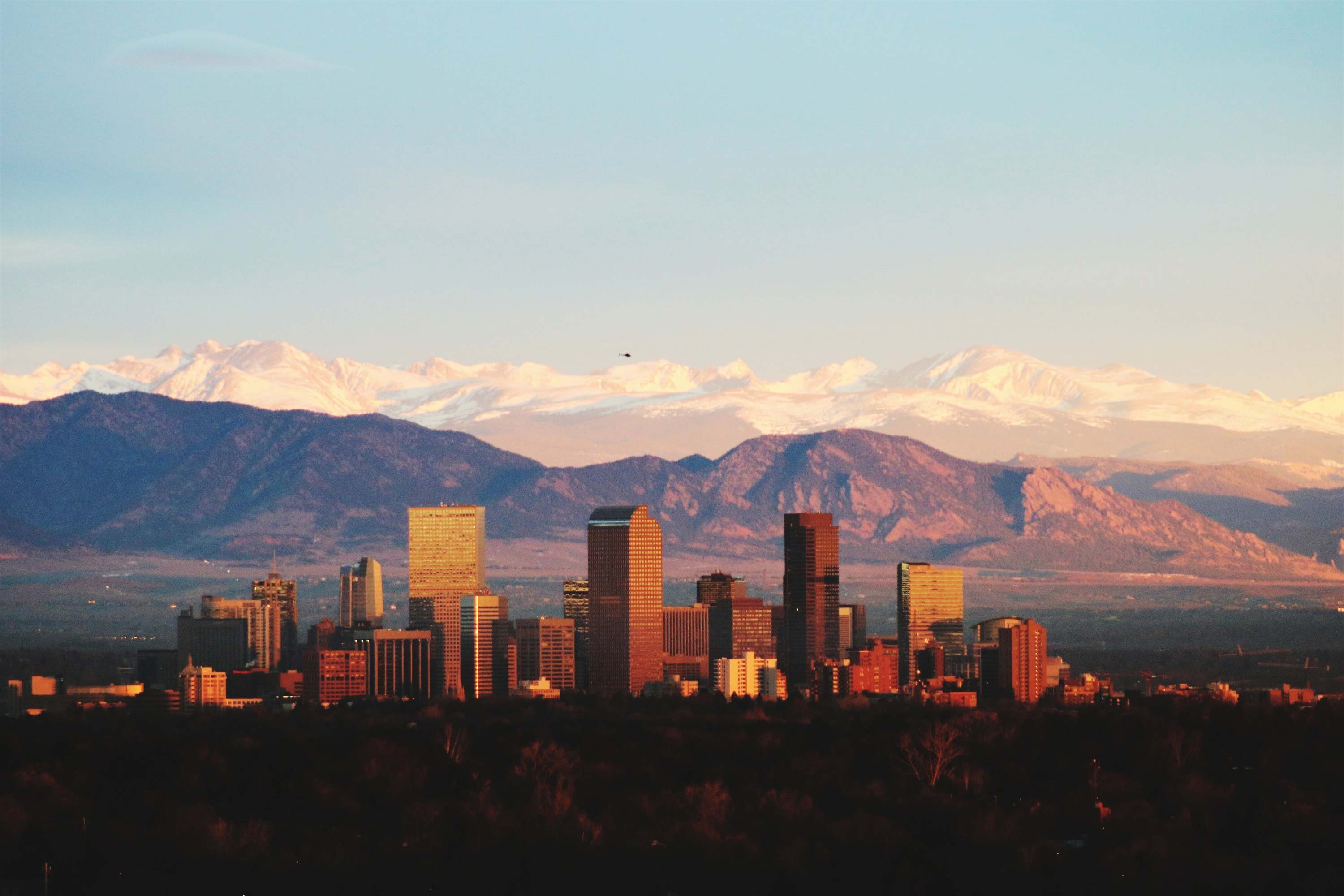 Denver, Colorado city skyline at sunset.